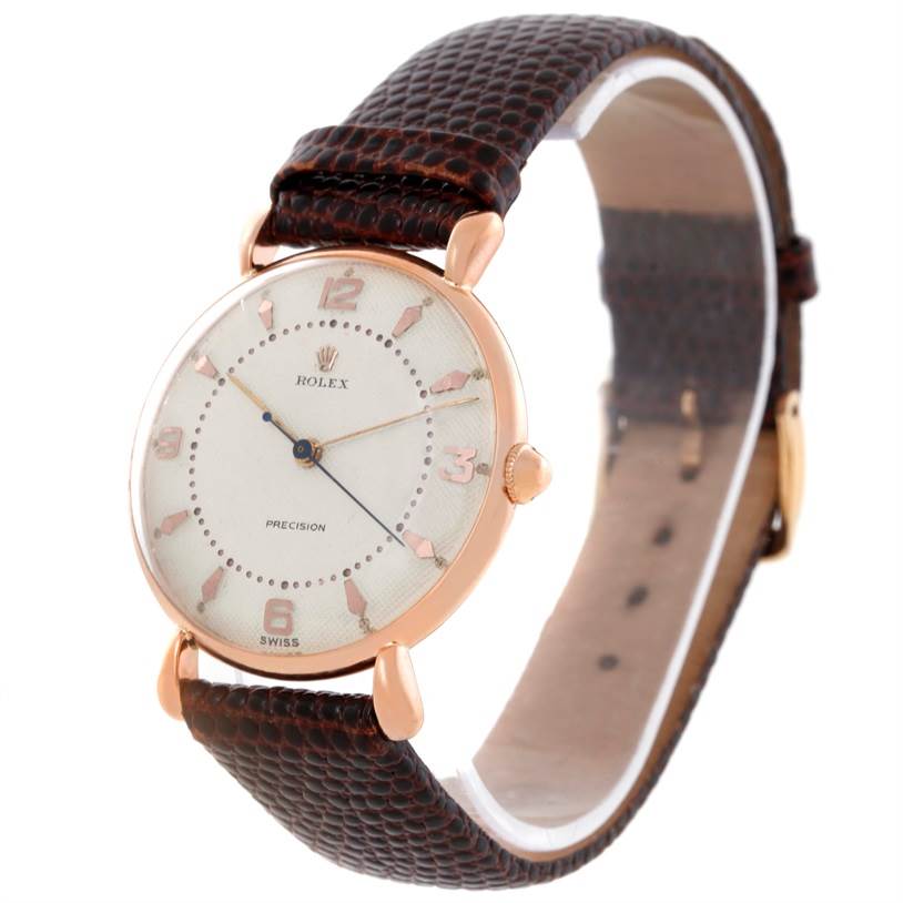 The image shows a Rolex Vintage Collection Men's Rose Gold White Dial Men's Rose Gold White Dial watch at a three-quarter angle, displaying the face, crown, and leather strap.