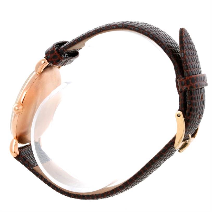 The image shows a side view of a Rolex Vintage Collection Men's Rose Gold White Dial Men's Rose Gold White Dial watch, highlighting the leather strap and rose gold case.