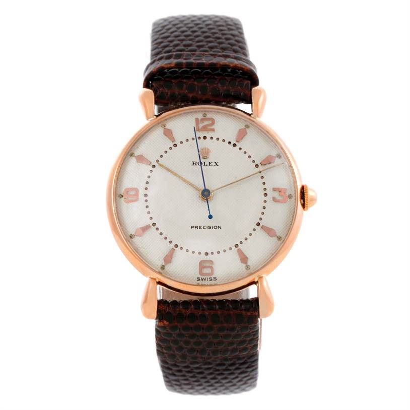 The Rolex Vintage Collection Men's Rose Gold White Dial Men's Rose Gold White Dial model watch is shown in a front view, highlighting its face, dial, hands, and leather strap.