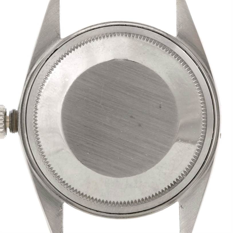 The image shows the case back of a Rolex Vintage Collection 1601 Stainless Steel Silver Dial 1601 Stainless Steel Silver Dial watch from a top-down angle.