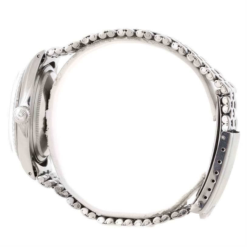 The image shows a side view of a Rolex Vintage Collection 1601 Stainless Steel Silver Dial 1601 Stainless Steel Silver Dial watch, highlighting the case, crown, and bracelet.