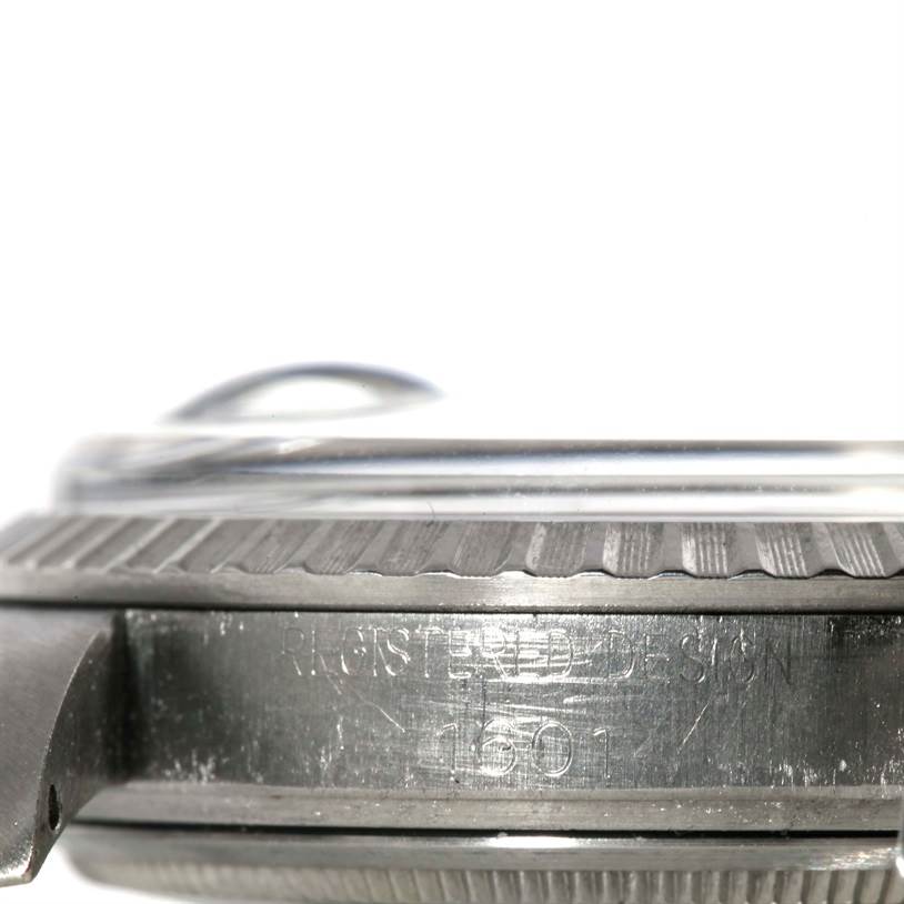 This close-up image shows the side profile of the bezel and case of the Rolex Vintage Collection 1601 Stainless Steel Silver Dial 1601 Stainless Steel Silver Dial model.