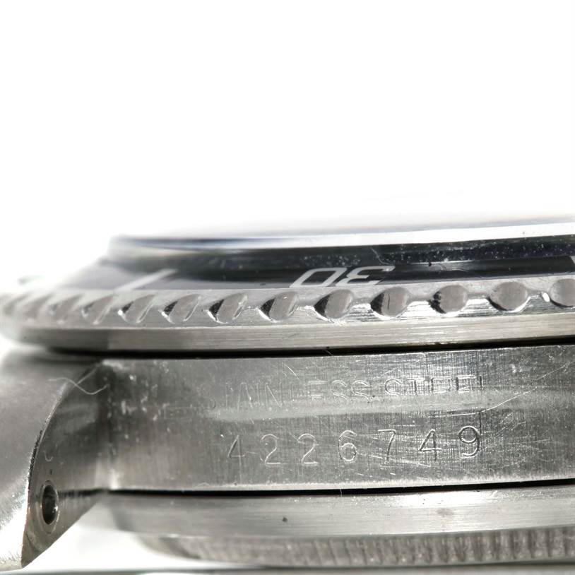The image shows a close-up side view of the case and bezel of a Rolex Vintage Collection 5513 Men's Stainless Steel Black Dial 5513 Men's Stainless Steel Black Dial watch, focusing on its engraving and serial number.