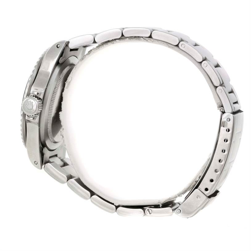 This image shows a side view of the Rolex Vintage Collection 5513 Men's Stainless Steel Black Dial 5513 Men's Stainless Steel Black Dial watch, highlighting the bracelet and crown.