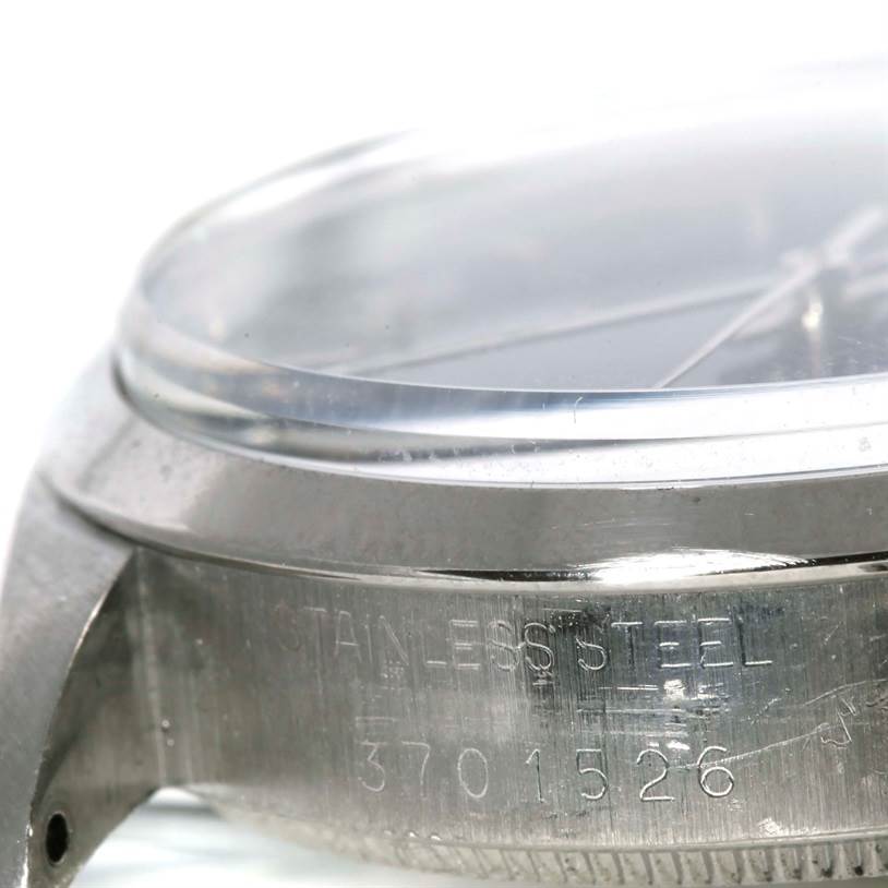 The image shows a close-up, side angle of the case and serial number engraving of the Rolex Vintage Collection 5500 Men's Stainless Steel Blue Dial 5500 Men's Stainless Steel Blue Dial watch.