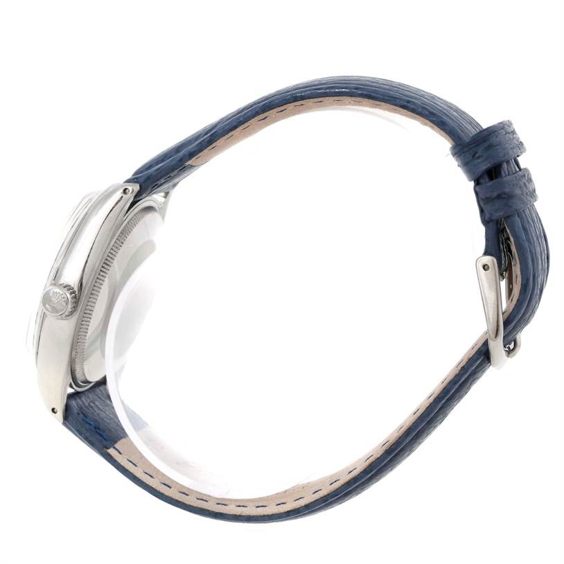 The image shows a side view of a Rolex Vintage Collection 5500 Men's Stainless Steel Blue Dial 5500 Men's Stainless Steel Blue Dial watch, highlighting its casing, crown, and blue leather strap with a buckle.