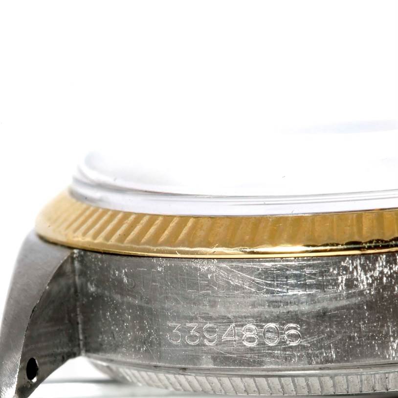 The image shows a close-up side view of the stainless steel and gold bezel, including the serial number of the Rolex Vintage Collection 5501 Men's Steel and Gold (two tone) Silver Dial 5501 Men's Steel and Gold (two tone) Silver Dial watch.