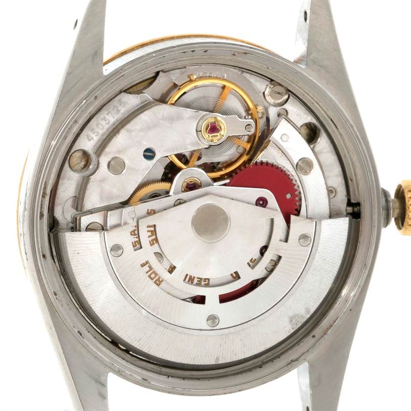 The image shows a close-up view of the internal mechanism and movement of the Rolex Vintage Collection 14203 Men's Steel and Gold (two tone) Champagne Dial 14203 Men's Steel and Gold (two tone) Champagne Dial watch.
