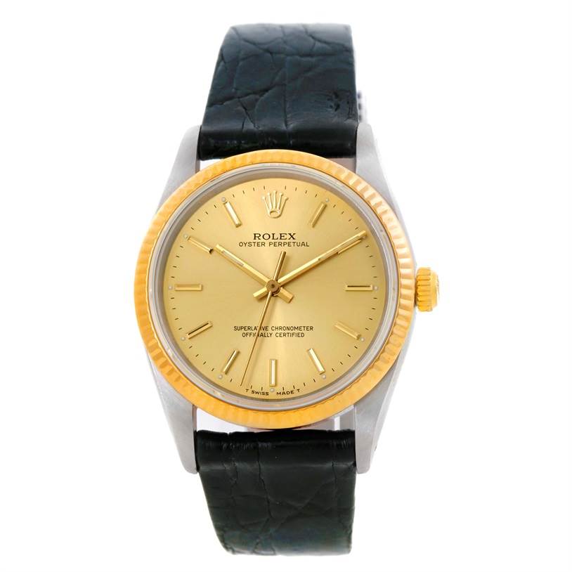 This image shows a front view of a Rolex Vintage Collection 14203 Men's Steel and Gold (two tone) Champagne Dial 14203 Men's Steel and Gold (two tone) Champagne Dial Oyster Perpetual watch with a gold dial and black leather strap.