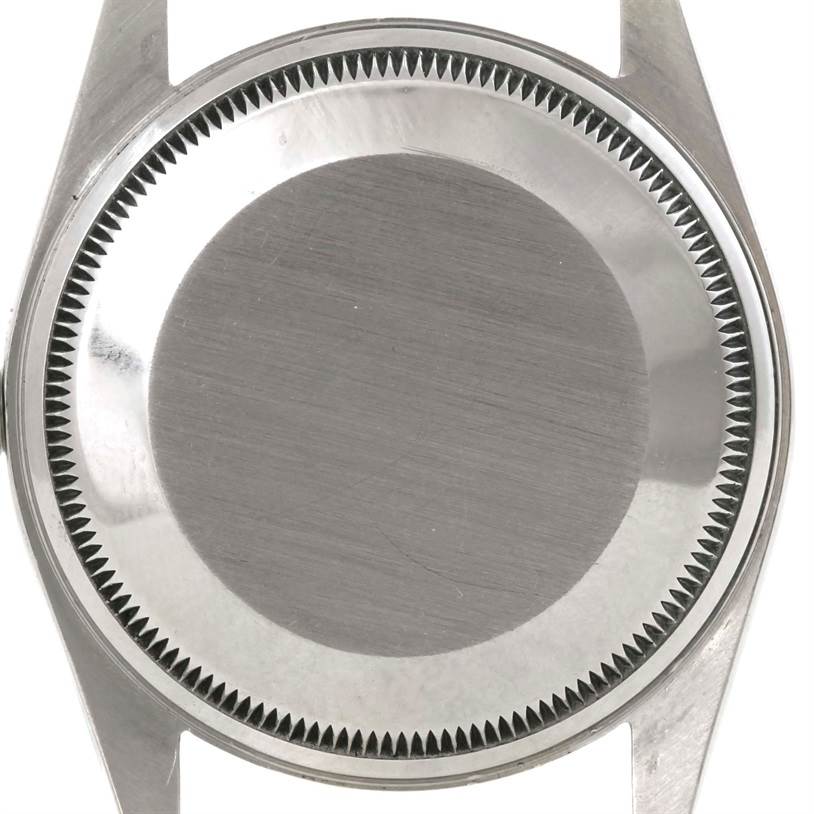 This image shows the caseback of the Rolex Vintage Collection 14203 Men's Steel and Gold (two tone) Champagne Dial 14203 Men's Steel and Gold (two tone) Champagne Dial watch from a top-down angle without the strap attached.