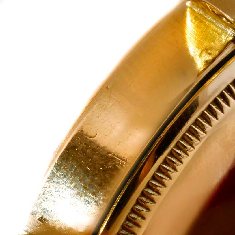 The close-up shows the side of the bezel and case of the Rolex Vintage Collection 6084 Men's Yellow Gold Silver Dial 6084 Men's Yellow Gold Silver Dial watch.