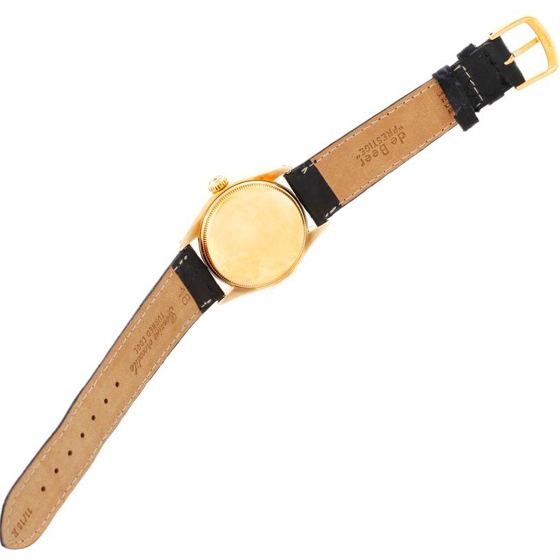 The image shows the back and strap of the Rolex Vintage Collection 6084 Men's Yellow Gold Silver Dial 6084 Men's Yellow Gold Silver Dial model watch.