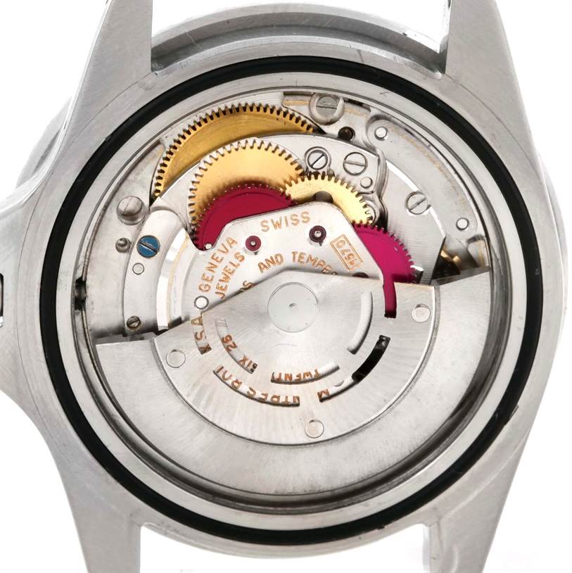 This is a close-up of the internal mechanism of a Rolex Vintage Collection 1675 Men's Stainless Steel Black Dial 1675 Men's Stainless Steel Black Dial watch, showing gears and movement components.