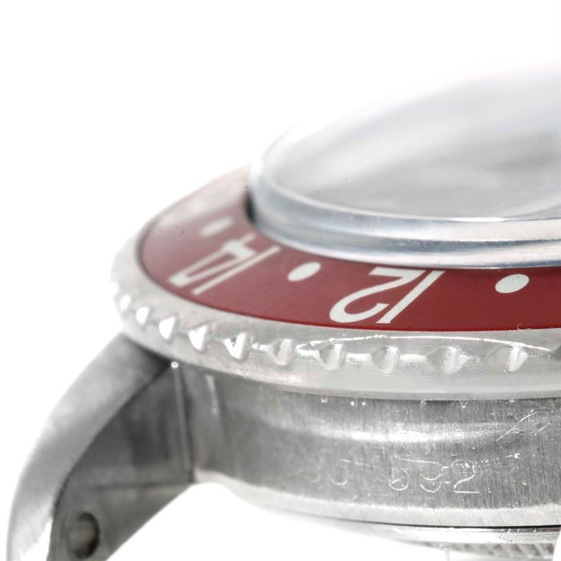 The image shows a side angle of the Rolex Vintage Collection 1675 Men's Stainless Steel Black Dial 1675 Men's Stainless Steel Black Dial watch, featuring the bezel and part of the watch case.