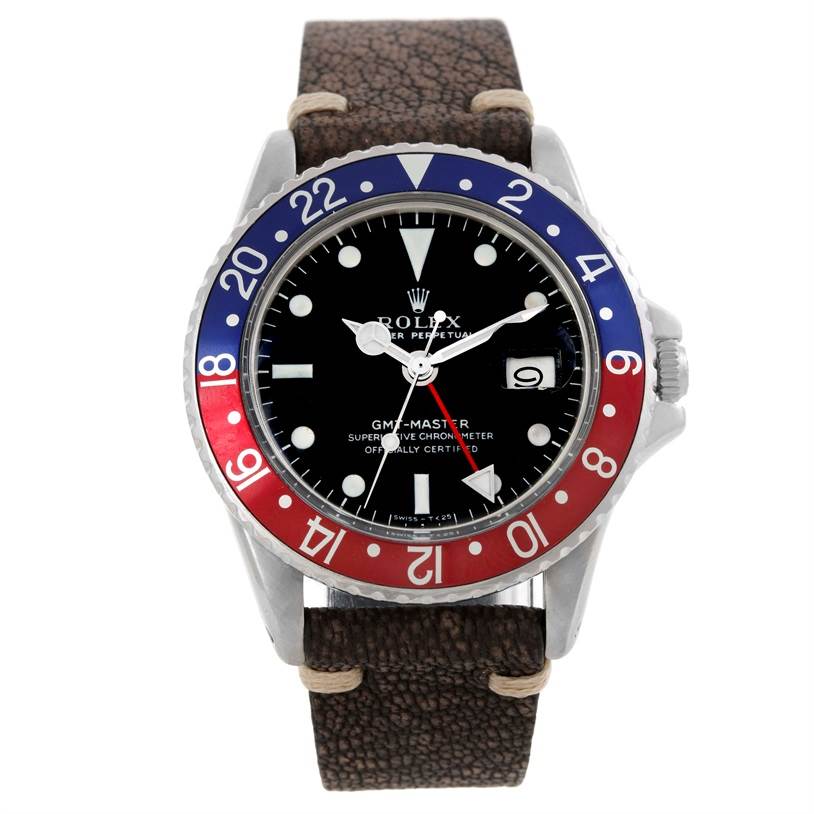 The image shows a frontal view of the Rolex Vintage Collection 1675 Men's Stainless Steel Black Dial 1675 Men's Stainless Steel Black Dial GMT-Master watch with a brown leather strap and a red and blue bezel.