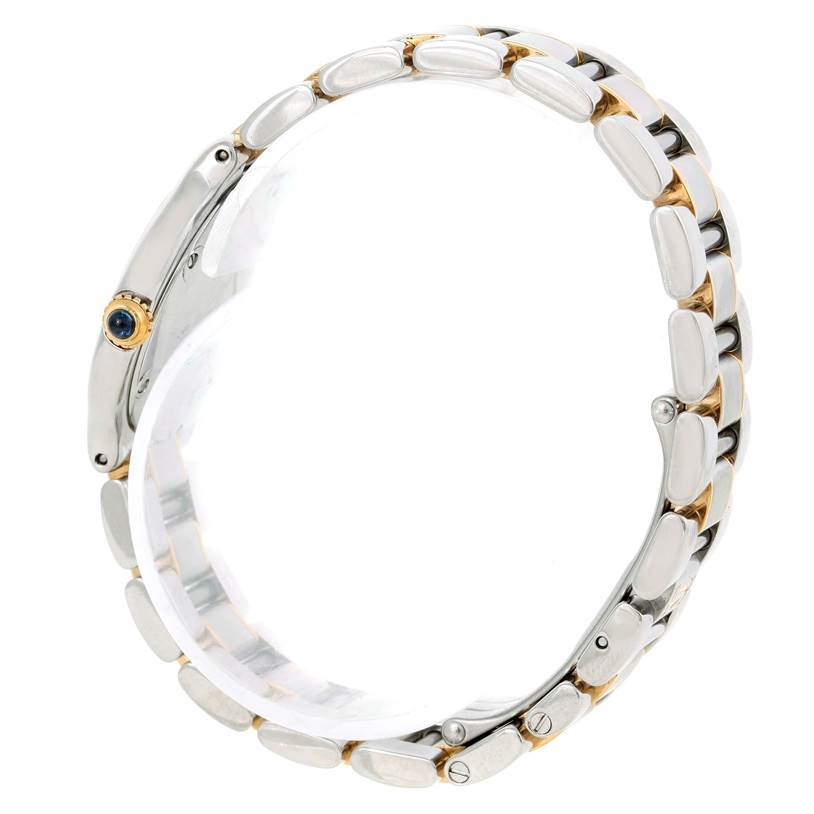 The image displays a side view of the Must 21 Cartier watch, focusing on its metal bracelet and winding crown.