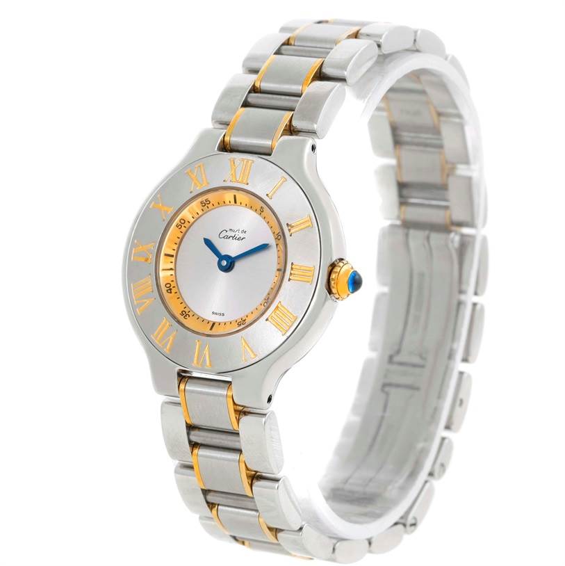 The image shows a Cartier Must 21 W10073R6 Women
s Stainless Steel Silver Dial W10073R6 Women
s Stainless Steel Silver Dial watch from a three-quarter perspective, highlighting the face, bezel, and band.