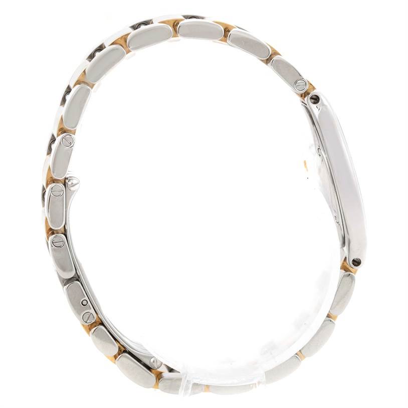 This side profile of a Cartier Must 21 W10073R6 Women
s Stainless Steel Silver Dial W10073R6 Women
s Stainless Steel Silver Dial watch shows its bracelet and case.