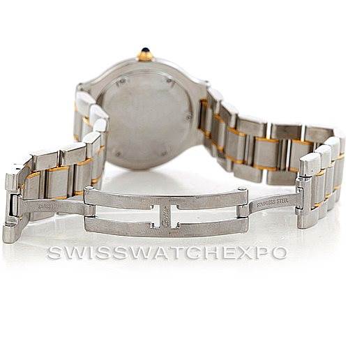 The image shows the back of a Cartier Must 21 W10073R6 Men's Stainless Steel Silver Dial W10073R6 Men's Stainless Steel Silver Dial watch with its metal bracelet fully opened.