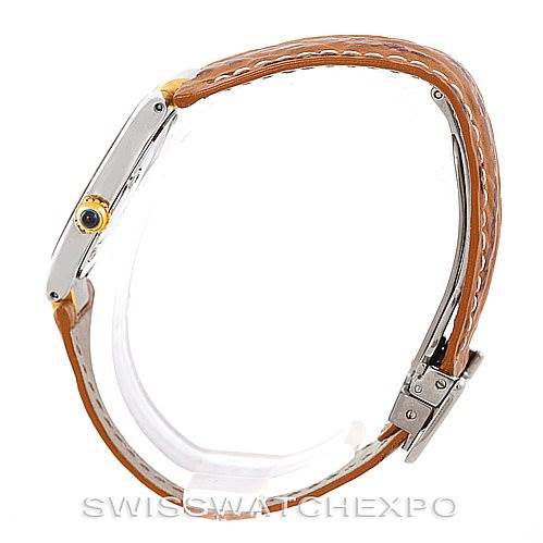 This image shows a side profile of the Cartier Must 21 W1007323 Men's Stainless Steel Silver Dial W1007323 Men's Stainless Steel Silver Dial watch with a focus on the case, crown, and brown leather strap.