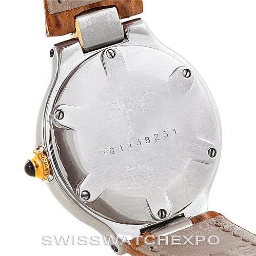 This image shows the back case of a Cartier Must 21 W1007323 Men's Stainless Steel Silver Dial W1007323 Men's Stainless Steel Silver Dial watch, displaying the serial number and part of the leather strap.