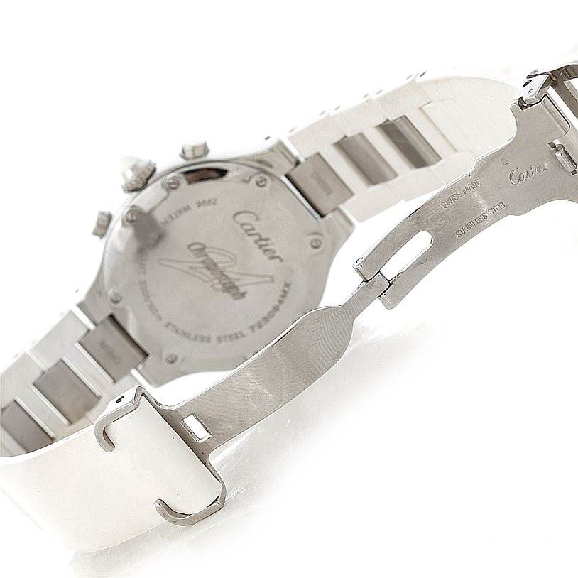 The image shows the back case and partially open clasp of a Must 21 Cartier watch.