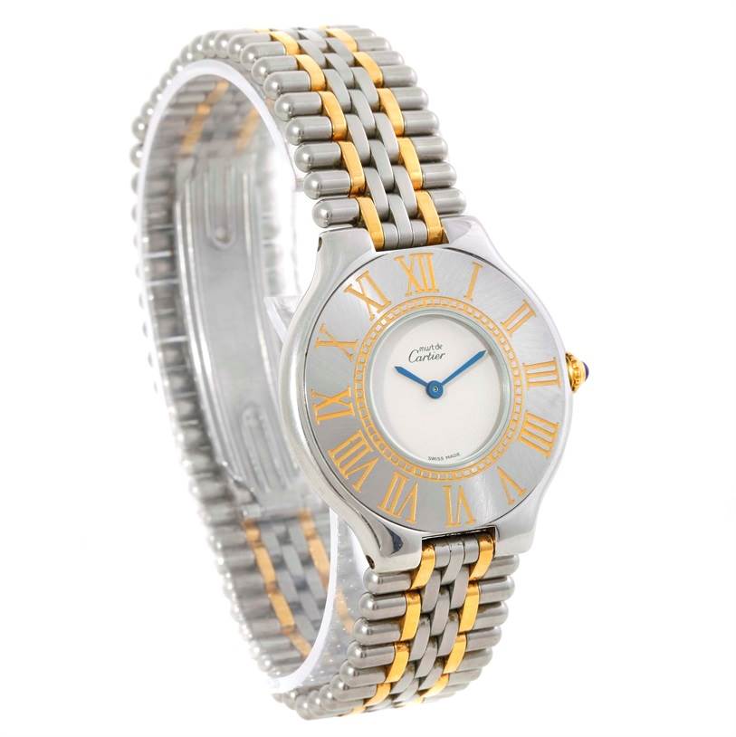 The image shows a Must 21 model watch by Cartier, featuring the dial, bezel, and two-tone metal bracelet at a three-quarter angle.