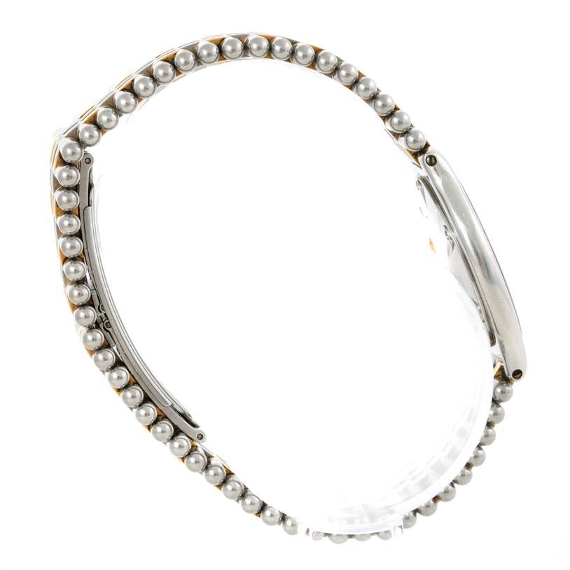 The image shows a side angle of the Cartier Must 21 W10073R6 Women's Stainless Steel Silver Dial W10073R6 Women's Stainless Steel Silver Dial watch, focusing on its metallic strap with pearl-like details.