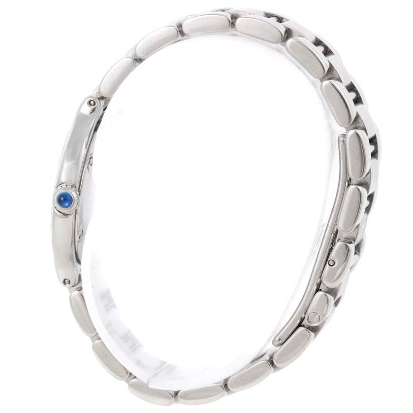 The image shows a side view of the Cartier Must 21 W10109T2 Men
s Stainless Steel Silver Dial W10109T2 Men
s Stainless Steel Silver Dial model, highlighting its bracelet and blue cabochon crown.