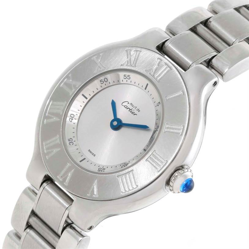 The image shows a close-up oblique view of the Cartier Must 21 W10109T2 Men
s Stainless Steel Silver Dial W10109T2 Men
s Stainless Steel Silver Dial watch displaying its dial, blue hands, Roman numerals, and part of the bracelet.