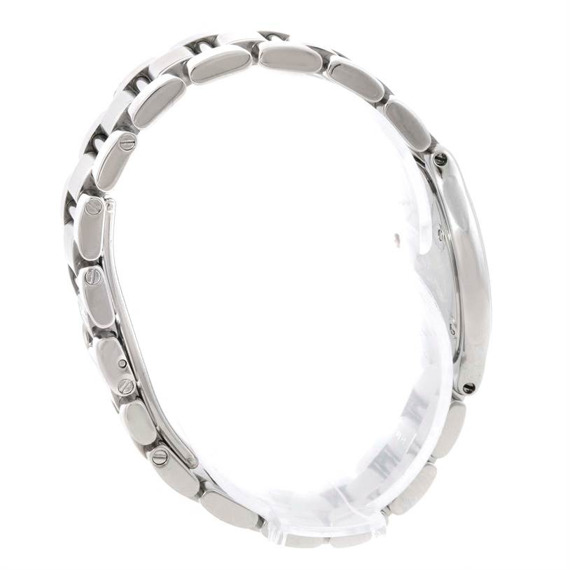 The image shows a side view of the Must 21 watch by Cartier, focusing on the bracelet links and case side.