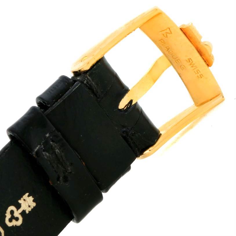 This image shows the buckle and part of the strap of the Corum Women's Yellow Gold Champagne Dial Women's Yellow Gold Champagne Dial 18K Yellow Gold Diamond 5 Gram Ingot 999.9 Watch.