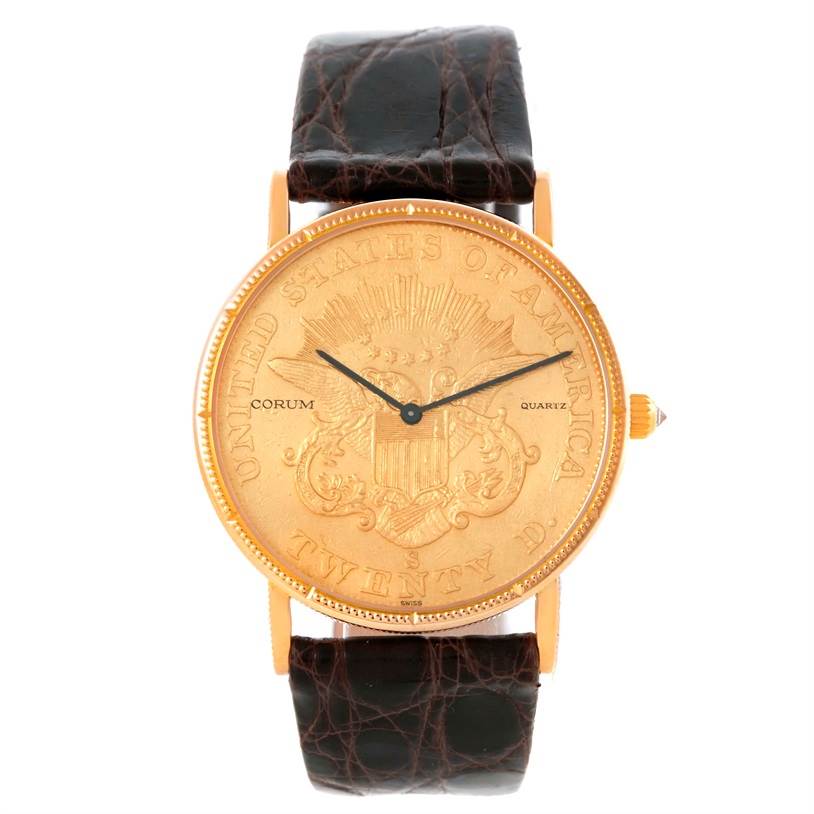 The Corum Coin Watch Men's Yellow Gold Black Dial Men's Yellow Gold Black Dial model is shown from the front, displaying its unique coin-inspired dial and leather strap.