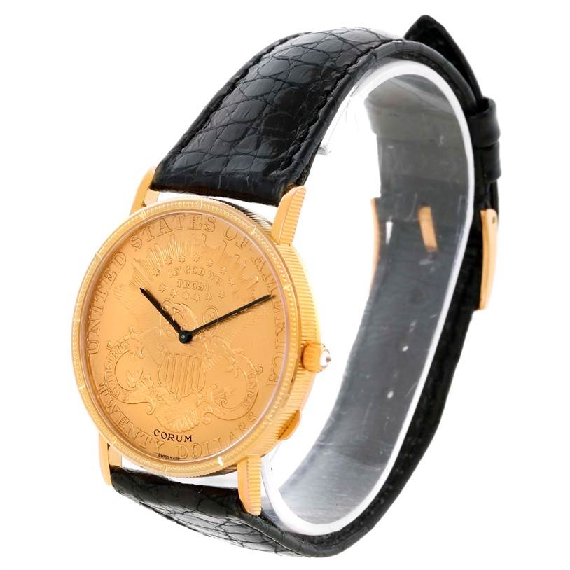 The image shows a Corum Coin Watch Men's Yellow Gold Black Dial Men's Yellow Gold Black Dial model at a three-quarter angle, highlighting the watch face, crown, and black leather strap.