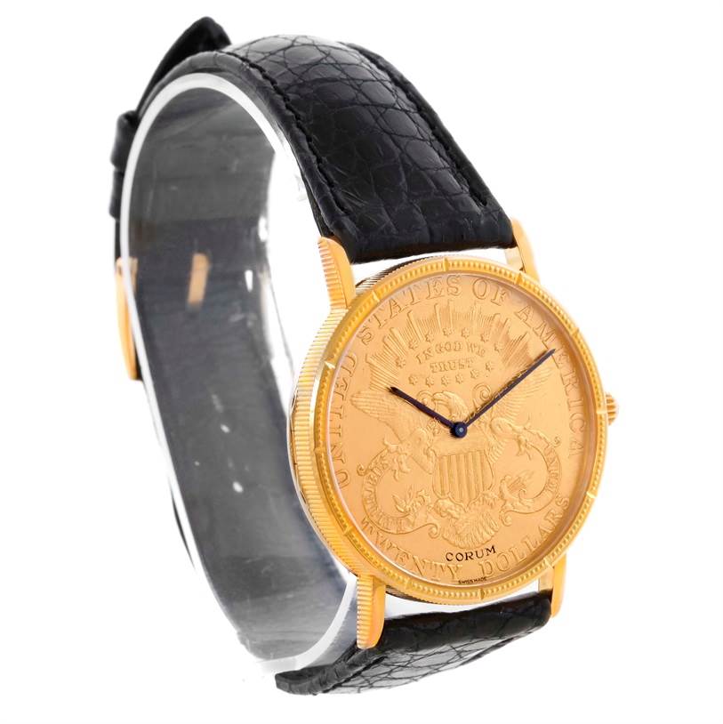 The image shows a Corum Coin Watch Men's Yellow Gold Black Dial Men's Yellow Gold Black Dial model at a slight angle, displaying the gold face and black leather strap.