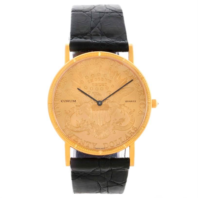 The image shows a front view of the Corum Coin Watch Men
s Yellow Gold Black Dial Men
s Yellow Gold Black Dial model, featuring its circular dial and black leather strap.