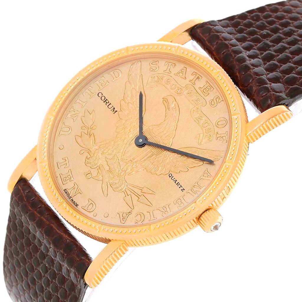 The image shows a close-up angle of the Corum Women's Yellow Gold Black Dial Women's Yellow Gold Black Dial 18K Yellow Gold 10 Dollars Coin Diamond Ladies Watch, highlighting the face and strap.