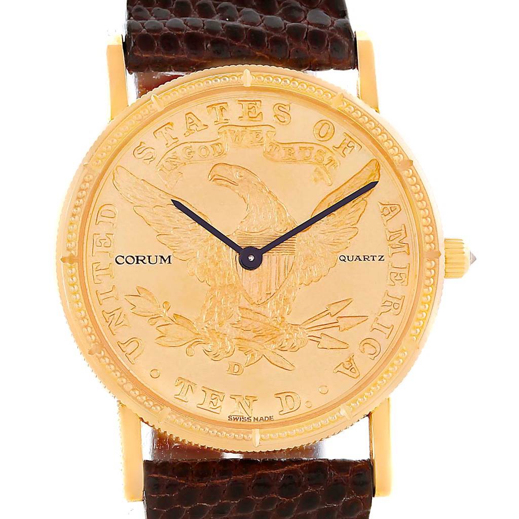 The image shows a front view of the Corum Women's Yellow Gold Black Dial Women's Yellow Gold Black Dial 18K Yellow Gold 10 Dollars Coin Diamond Ladies Watch model, displaying its face, gold case, and leather strap.