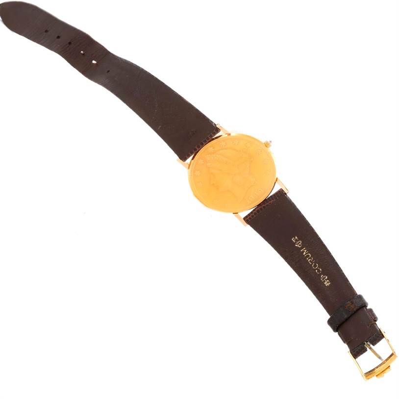 The image shows the full top view of the Corum Yellow Gold Black Dial Yellow Gold Black Dial 20 Dollars Double Eagle Yellow Gold Coin Brown Strap Watch.