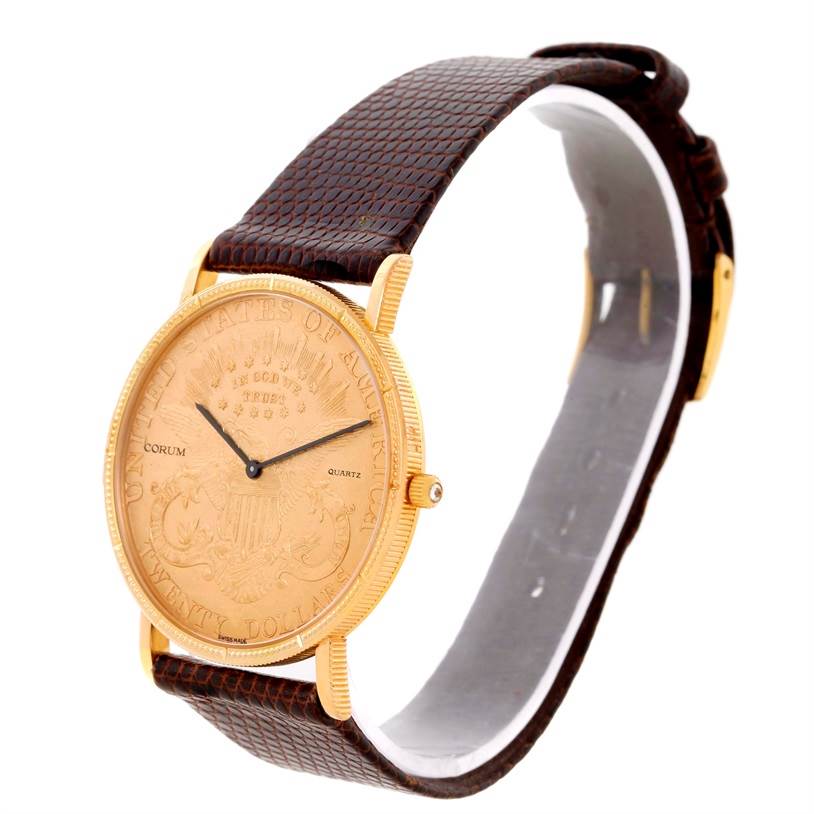 The Corum Yellow Gold Black Dial Yellow Gold Black Dial 20 Dollars Double Eagle Yellow Gold Coin Brown Strap Watch is shown at a three-quarter angle, highlighting its face and strap.