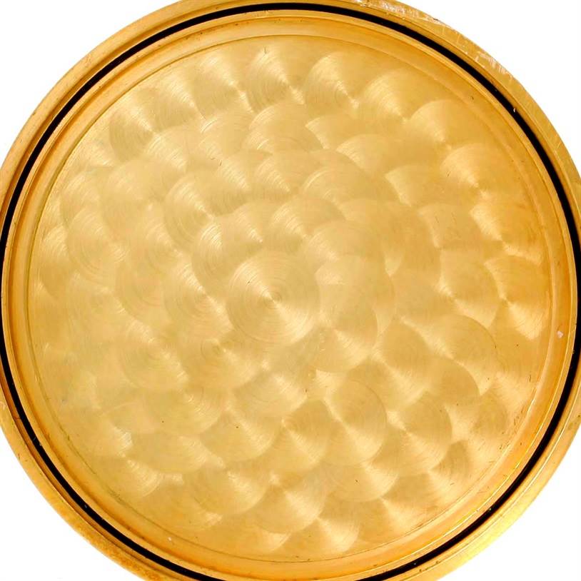 This is a detailed view of the back casing of the Corum Yellow Gold Black Dial Yellow Gold Black Dial 20 Dollars Double Eagle Yellow Gold Coin Brown Strap Watch.