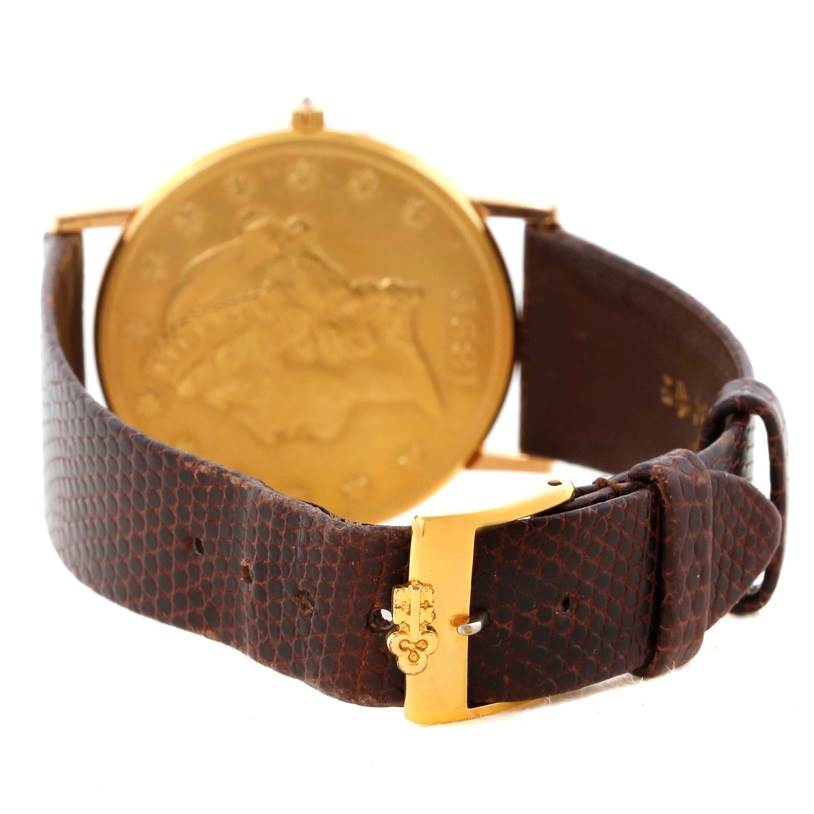 The image shows the back of the Corum Yellow Gold Black Dial Yellow Gold Black Dial 20 Dollars Double Eagle Yellow Gold Coin Brown Strap Watch.