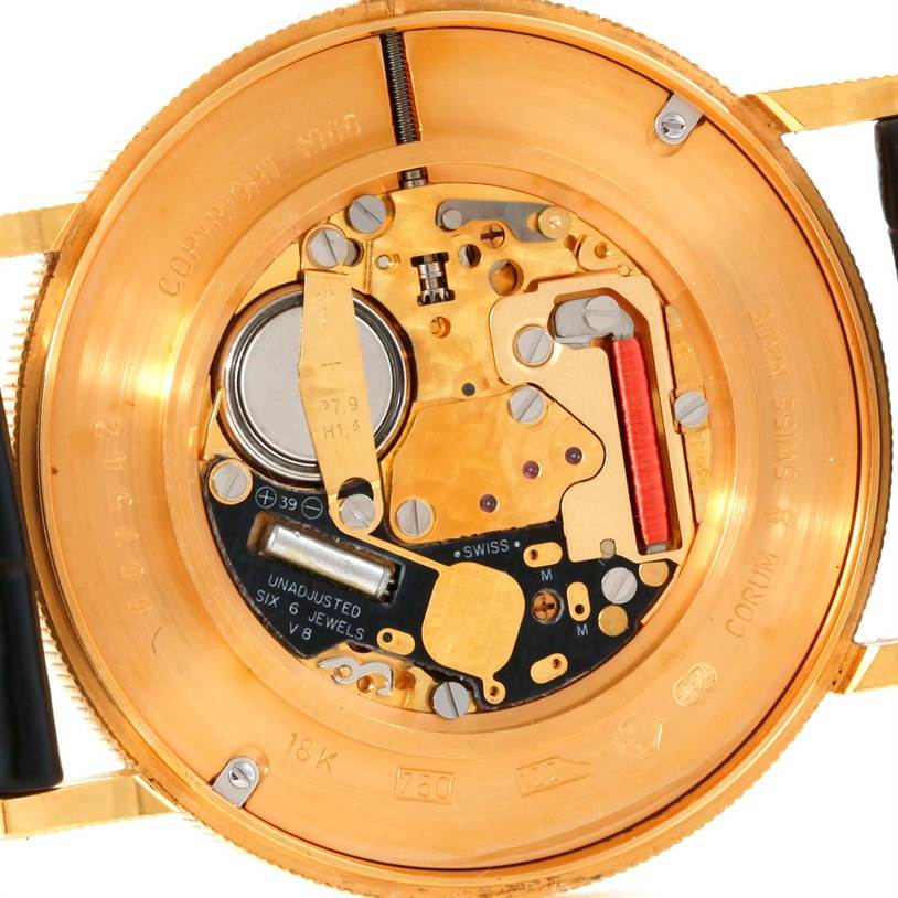 This is a close-up view of the back of a Corum Coin Watch Men's Yellow Gold Black Dial Men's Yellow Gold Black Dial, showcasing the internal mechanism and components.