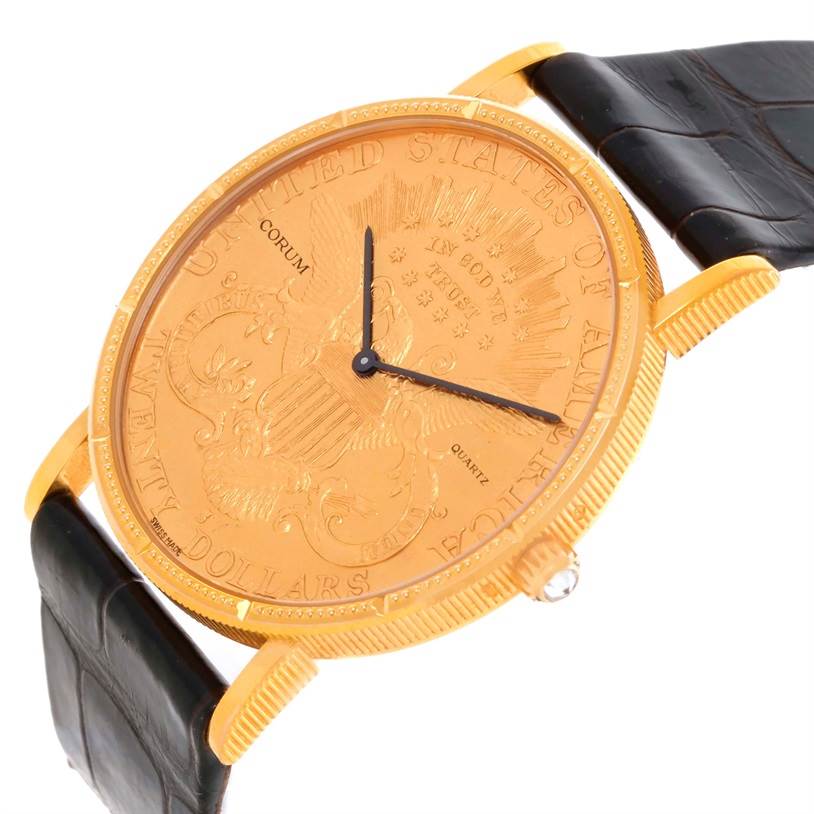 The image shows a Corum Coin Watch Men's Yellow Gold Black Dial Men's Yellow Gold Black Dial from a slightly tilted front angle, highlighting its gold face, black leather strap, and intricate engravings.