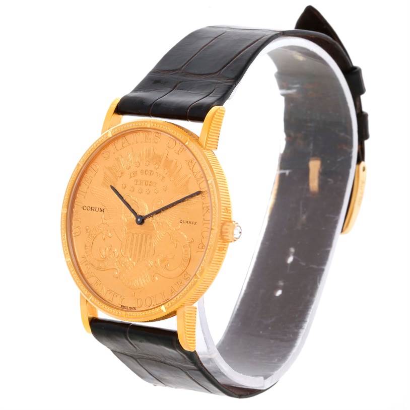 The image displays a Corum Coin Watch Men's Yellow Gold Black Dial Men's Yellow Gold Black Dial model from an angle showing the gold watch face, black leather strap, and side profile.