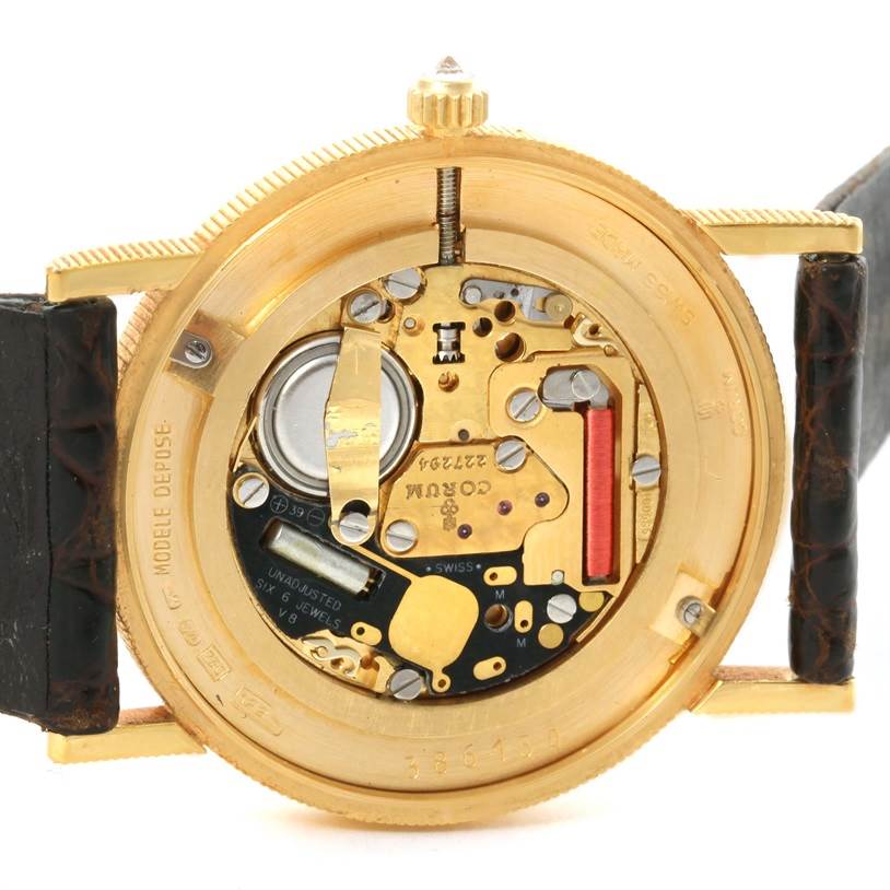 The image shows the back view and internal mechanism of a Corum Yellow Gold Black Dial Yellow Gold Black Dial 1893 18K Yellow Gold 10 Coin Diamond Watch.