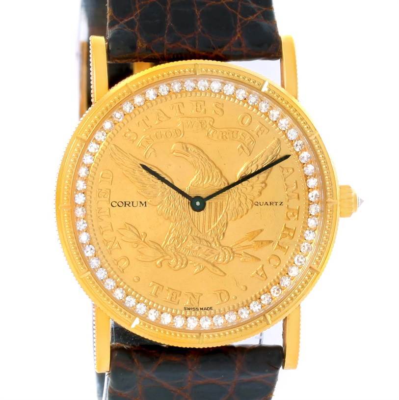 The image shows a front view of the Corum Yellow Gold Black Dial Yellow Gold Black Dial 1893 18K Yellow Gold 10 Coin Diamond Watch, featuring its detailed face and leather strap.
