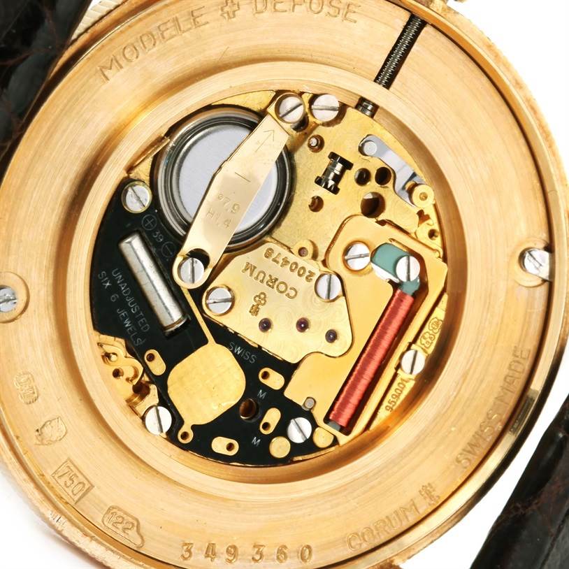 This image shows a close-up view of the internal mechanism of a Corum Coin Watch Men's Yellow Gold Black Dial Men's Yellow Gold Black Dial.