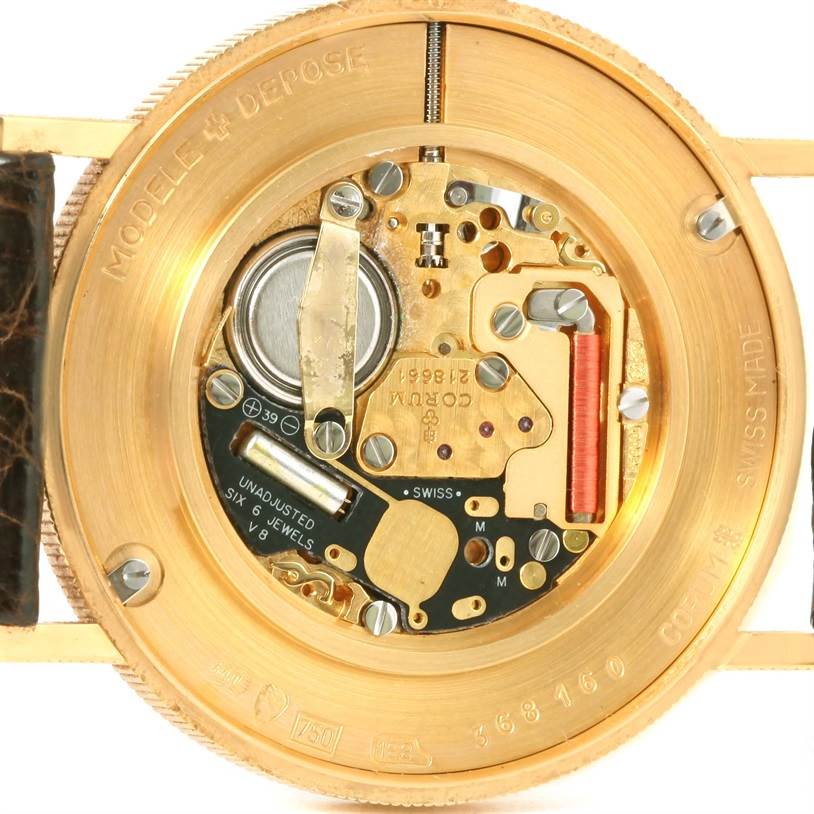 The image shows the internal mechanism of a Corum Coin Watch Men's Yellow Gold Black Dial Men's Yellow Gold Black Dial model, viewed from the back.