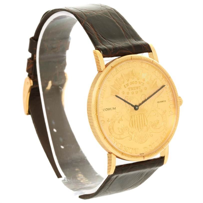 The Coin Watch model by Corum is shown at a side angle, displaying its gold face, leather strap, and lugs.